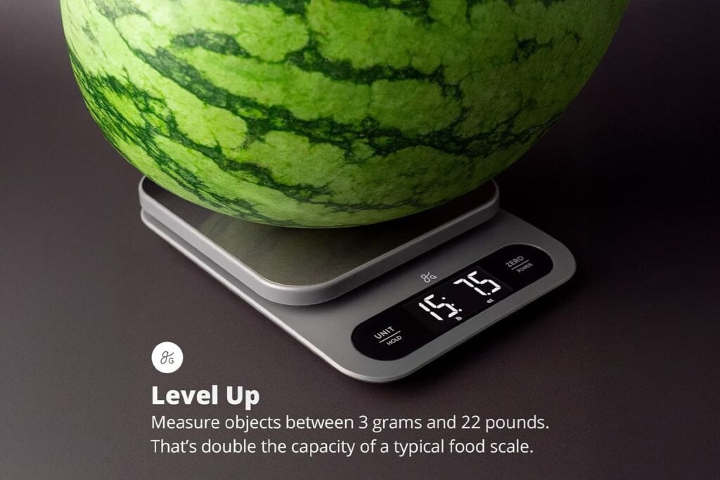A watermelon is sitting on a high capacity scale up to 22 pounds