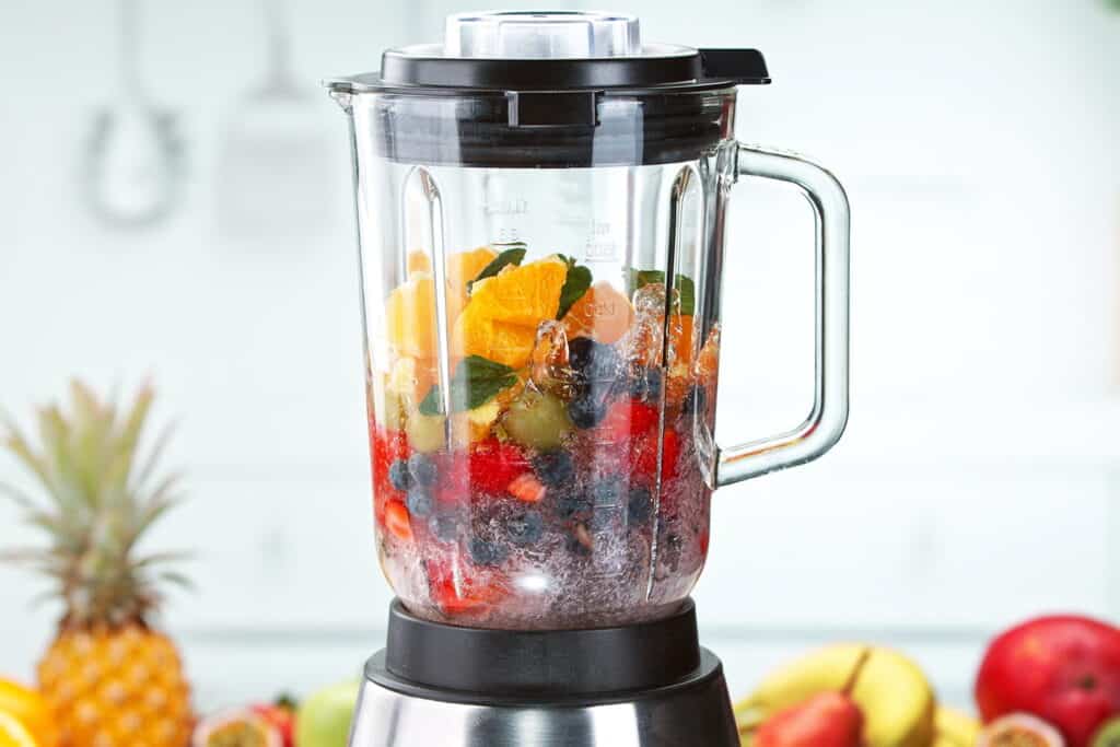blender filled with fruit